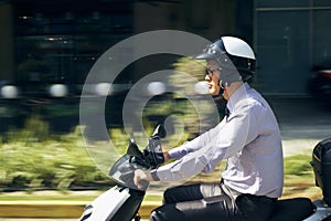 Chinese Businessman Commuter Riding Scooter Motorcycle In City