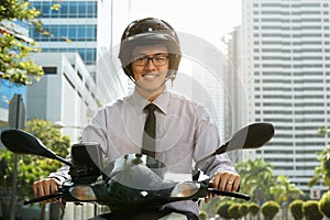 Chinese Businessman Commuter Using Scooter Motorcycle In City