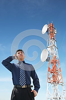 Chinese businessman on phone and antenna