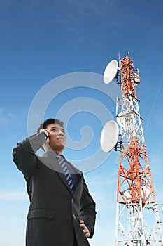 Chinese businessman on phone and antenna