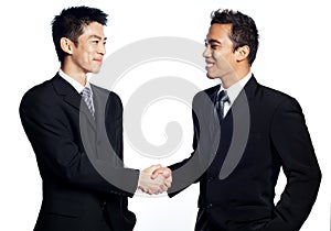 Chinese businessman shaking hands with African