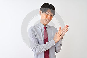 Chinese businessman wearing elegant tie standing over isolated white background clapping and applauding happy and joyful, smiling