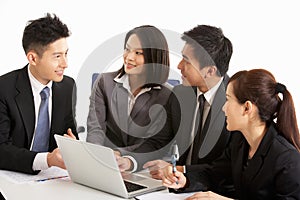 Chinese Businesspeople Having Meeting