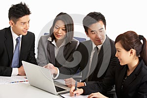 Chinese Businesspeople Having Meeting