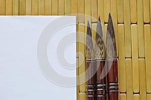 Chinese calligraphy variety size and white paper on bamboo