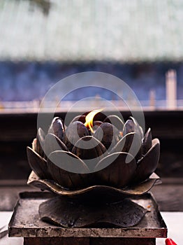 Chinese Candle Flame with Candle Oil Holder in Shaolin Temple. Dengfeng City, Zhengzhou City, Henan Province, China, 18th October