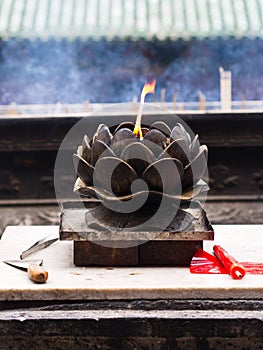 Chinese Candle Flame with Candle Oil Holder in Shaolin Temple. Dengfeng City, Zhengzhou City, Henan Province, China, 18th October