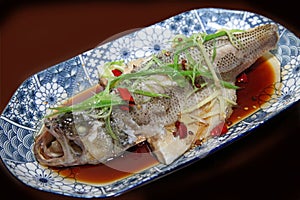 Chinese Cantonese cuisine- -steamed bass.