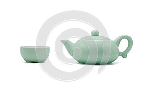 Chinese ceramic green teapot and teacup isolated on white