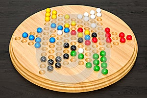 Chinese checkers on the wooden table, 3D rendering