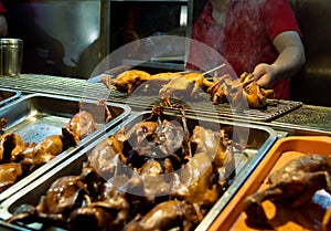 Chinese chef cooking traditional on the snack street in Beijing China. Delicious street fast food