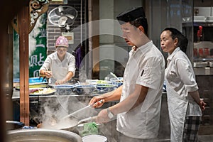 Chinese chef preparing hot food