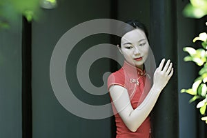 Chinese cheongsam model in Chinese classical garden