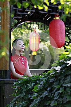 Chinese cheongsam model in Chinese classical garden