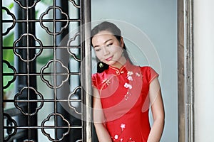 Chinese cheongsam model play in a famous garden