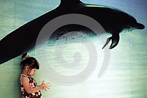 Chinese child and dolphin