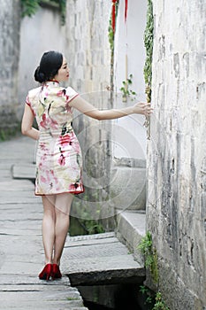 Chinese classic beauty in cheongsamï¼Œ enjoy free time.