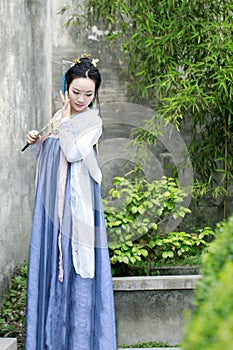 Chinese classic beauty in traditional Hanfu dress enjoy free time