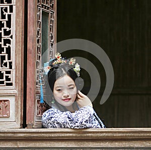 Chinese classic woman in Hanfu dress enjoy free time