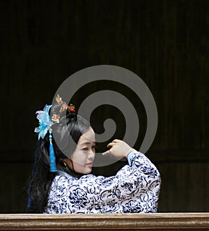 Chinese classic woman in Hanfu dress enjoy free time