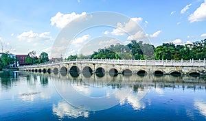 Chinese classical architectural arch bridge in Guangfulin Park, China, in daylight