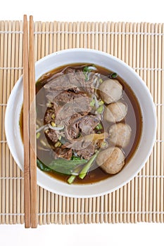 Chinese clear soup with boiled entrails and vegetables photo