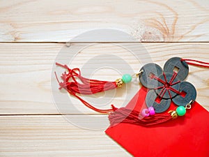 Chinese coins lucky charm and red packet for Chinese New Year background