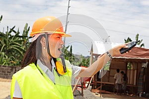 Chinese construction engineer directing