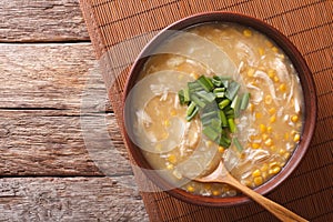 Chinese corn and chicken soup in a bowl close-up. horizontal top