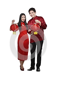 Chinese couple wear cheongsam holding lantern