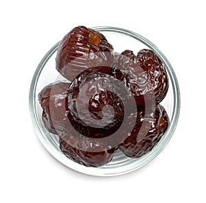 Chinese date or Jujube or monkey apple in syrup with glass bowl isolated on white background