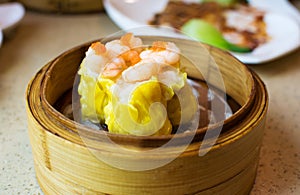 Chinese dimsum shrimp shao mai in bamboo steamer