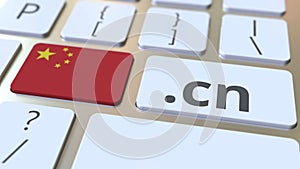 Chinese domain .cn and flag of China on the buttons on the computer keyboard. National internet related 3D rendering