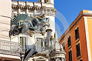 Chinese dragon on 19th century House of Umbrellas (Casa Bruno Cuadros) on La Rambla in Barcelona, Catalonia, Spain, photo