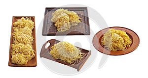 Chinese dry noodle in wooden tray on white background