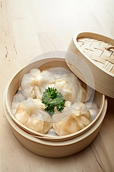 Chinese dumpling in a bamboo steamer box