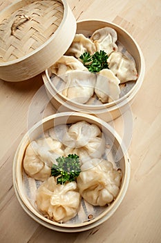 Chinese dumpling in a bamboo steamer box