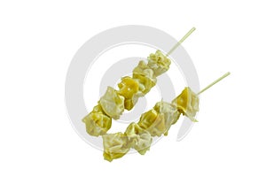 Chinese dumpling stabbing wooden stick on white background
