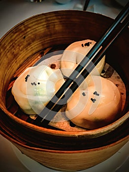 Chinese dumplings or Dim Sum on a wooden offering a taste of authenticity and culinary charm.