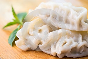 Chinese dumplings or Jiaozi with chopstick