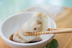 Chinese dumplings or Jiaozi with chopstick photo