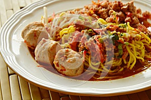 Chinese egg noodle dressing spicy pork ball with dried shrimp soup