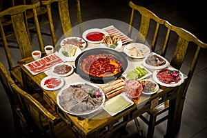 Chinese Eight Immortals Table Traditional Beef Hot Pot Cuisine and Ingredients