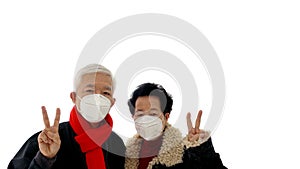 Chinese elder senior couple wear mask protect corona virus give love and encourage victory gesture to Wuhan