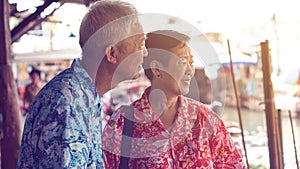 Chinese elderly couple travel to Thailand floating market retirement fun trip