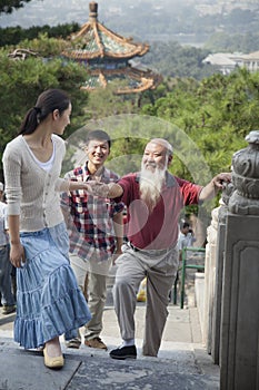 Chinese Family Walking In Jing Shan Park photo