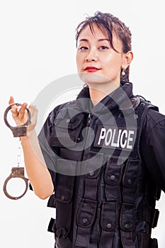Chinese female police officer holding handcuffs