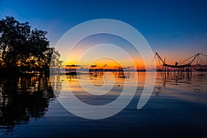 Chinese fish nets during sunrise