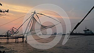 Chinese fishing net at sunrise in Cochin, Kerala, India. Famous landmark in Fort Kochi