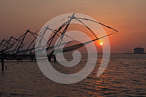 Chinese fishnets on sunset. Kochi, Kerala, India photo